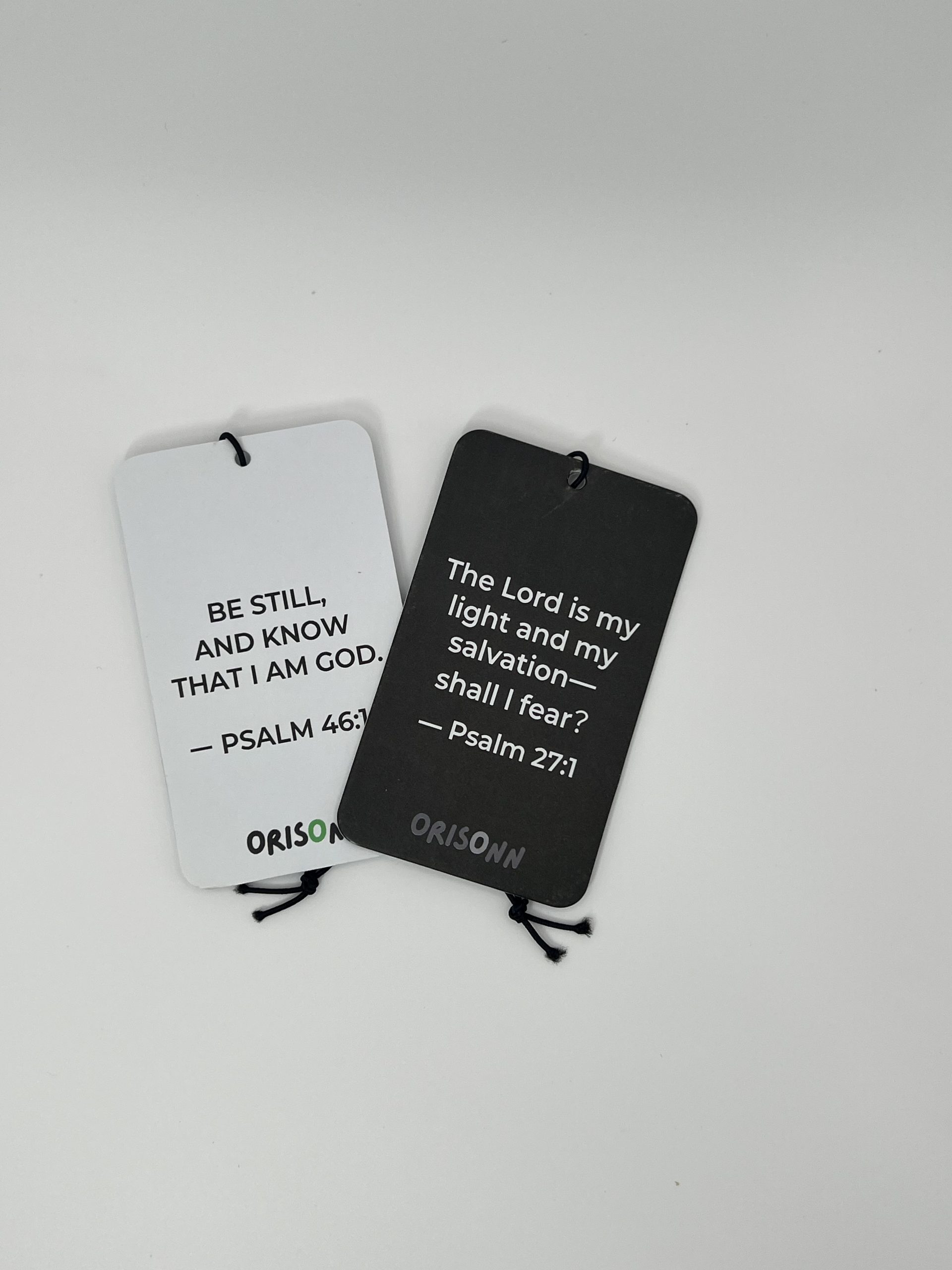 Christian Car Air Freshener 2-Pack featuring Psalm 46:10 Be Still and Know That I Am God and Psalm 27:1 The Lord Is My Light with New Car and Black Ice fragrances by ORISONN.